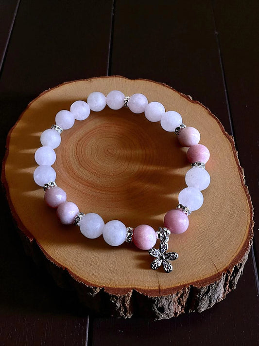 Crystal bracelet combining rose quartz and pink opal for compassion and renewal.