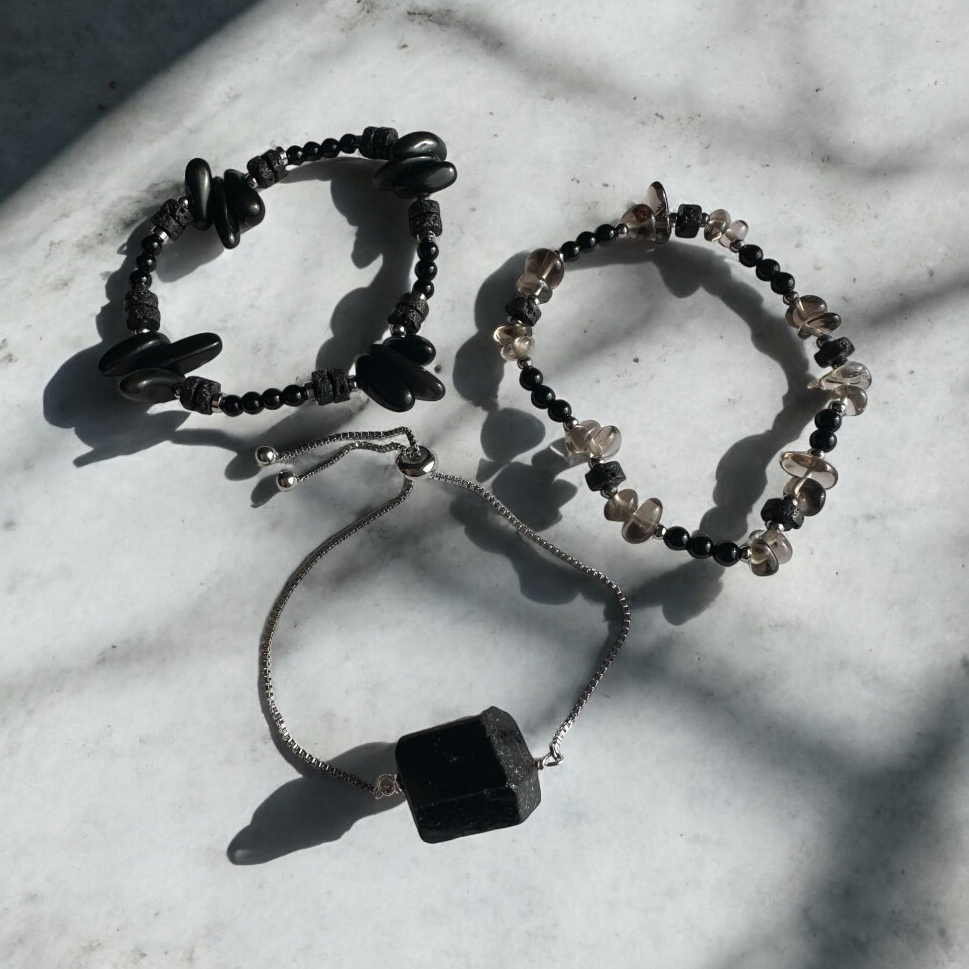 3 bracelets of Black Onyx, Black Tourmaline, Lava Stone, and Smoky Quartz Crystal 