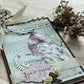 A6 cockatoo notebook with Nepalese paper, ribbons, and paper flowers—customisable handmade spiral journal with 40 white pages and shabby chic charm.