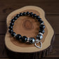 Black crystal bracelet with hematite, onyx, and obsidian stones