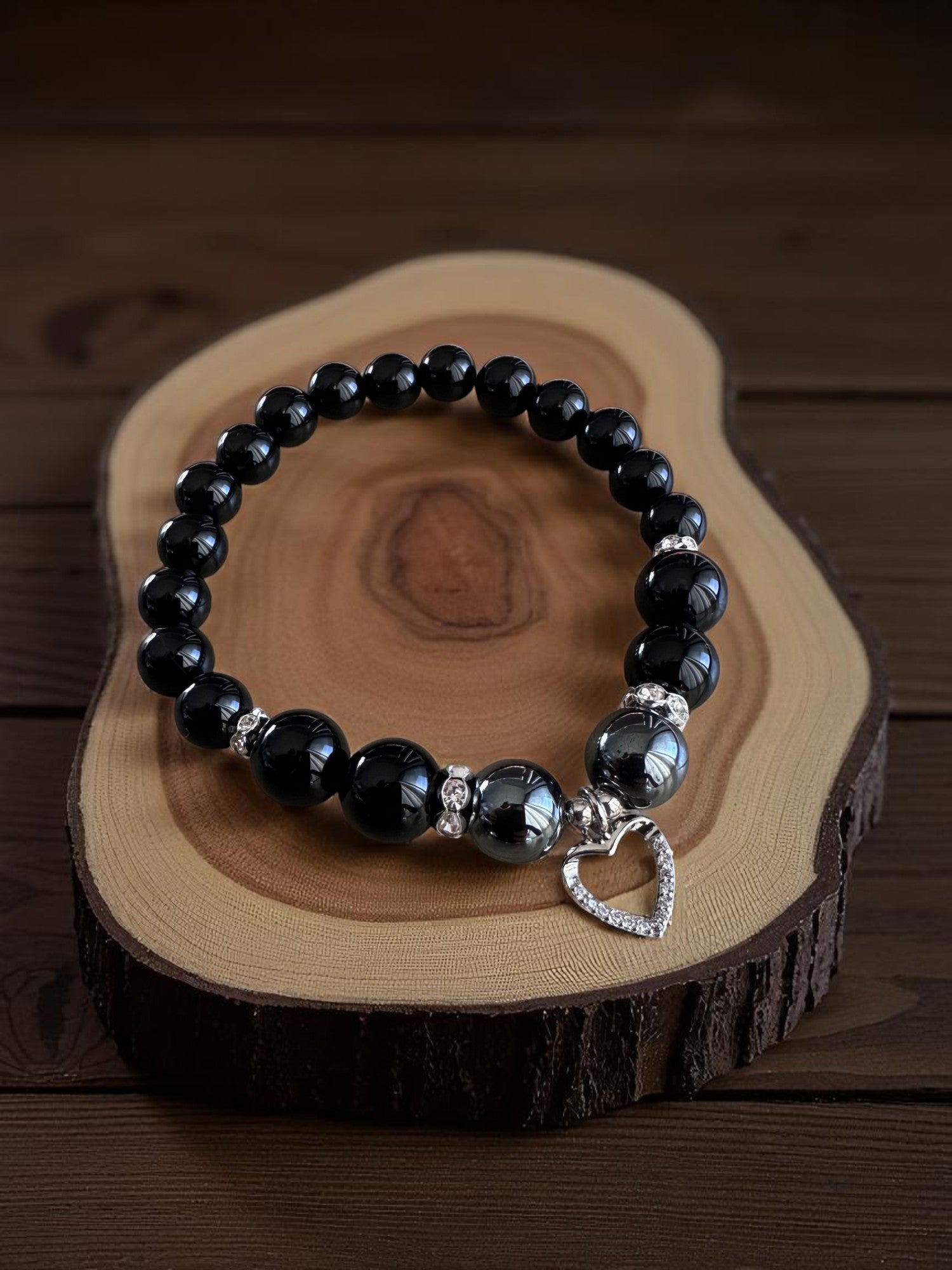 Black crystal bracelet with hematite, onyx, and obsidian stones