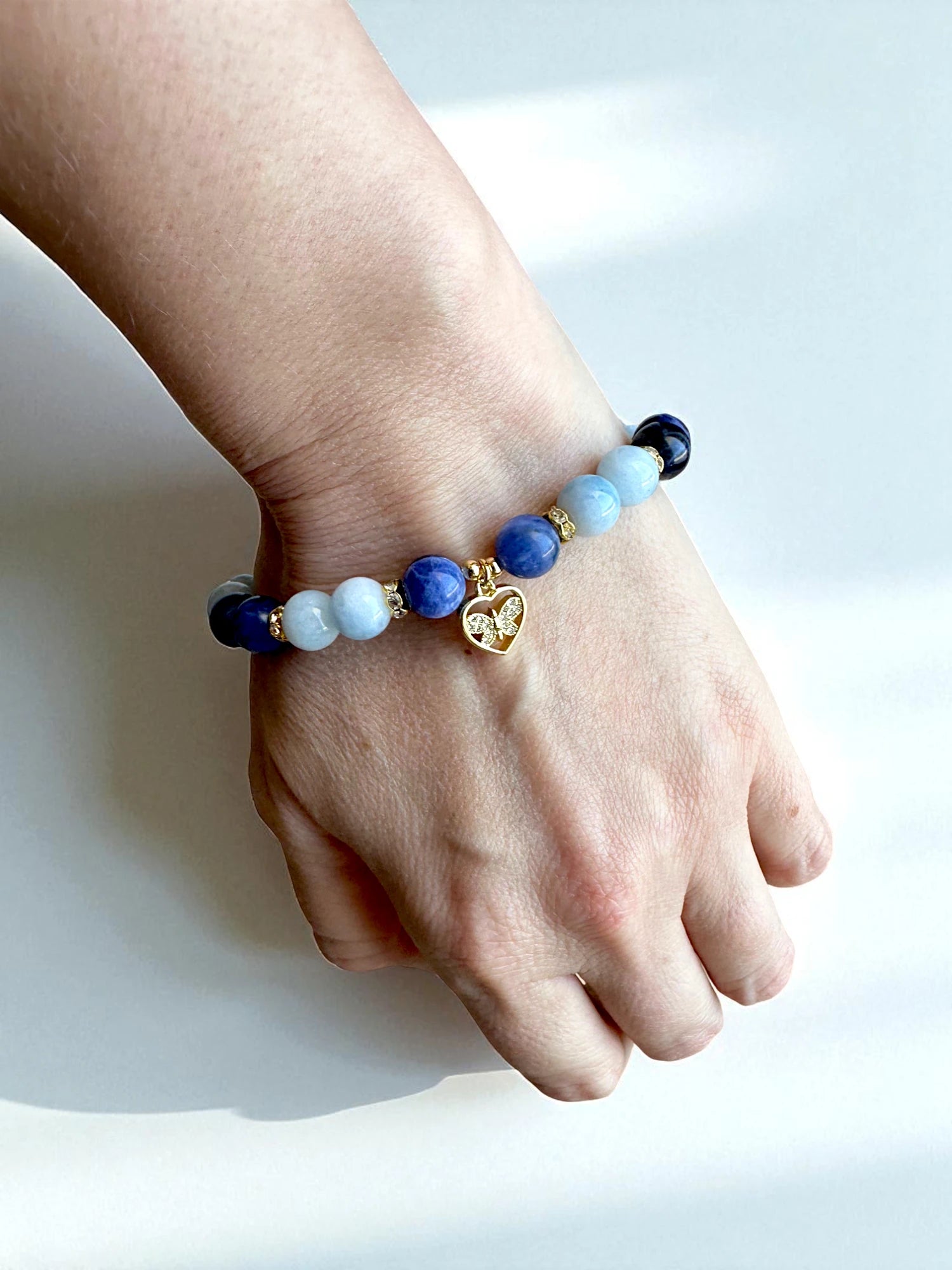 Blue gemstone bracelet combining aquamarine and sodalite for peace and truth