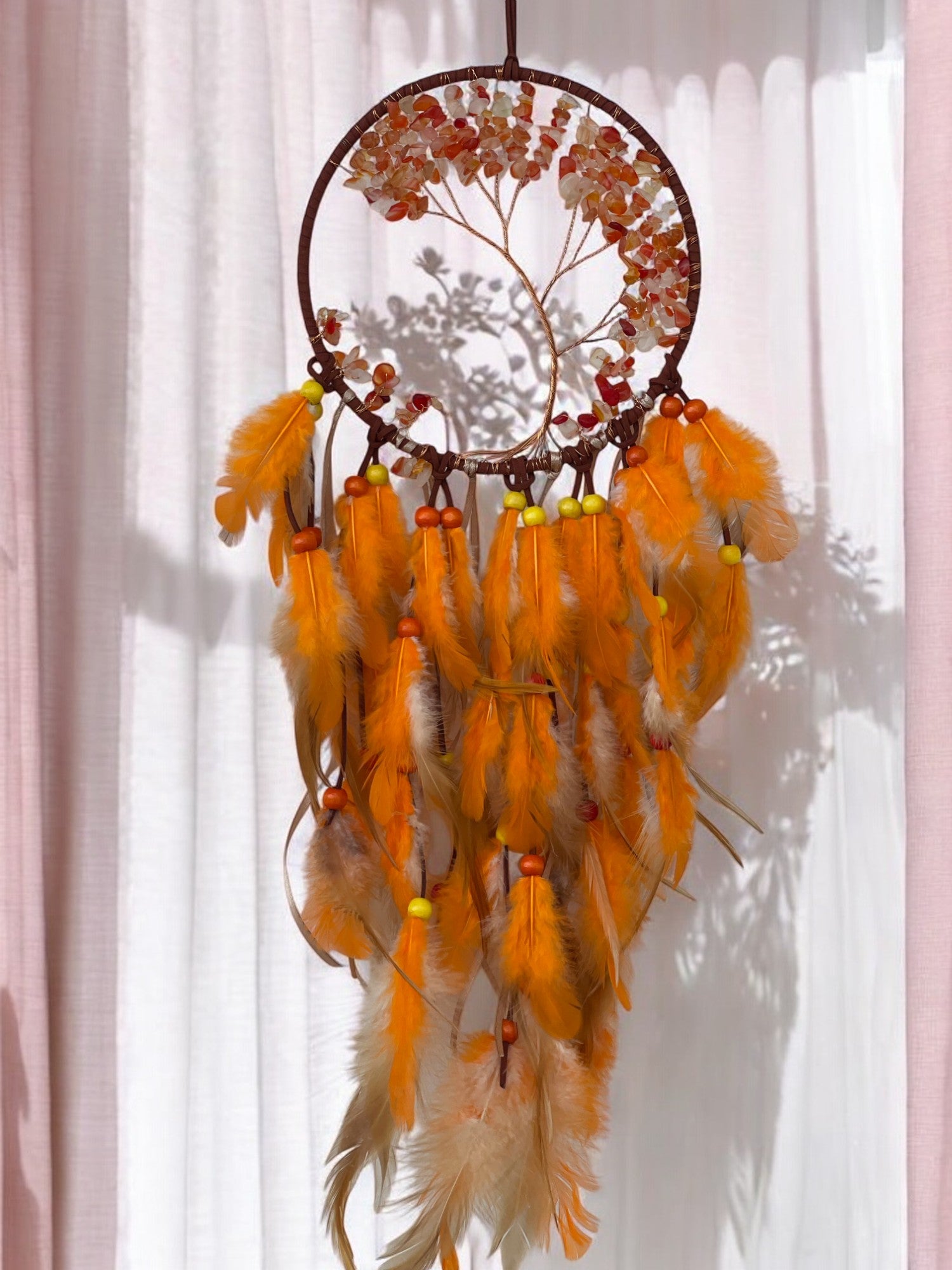 Carnelian crystal dreamcatcher in a sunshine