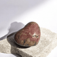 Close-up of a Rhodochrosite heart's intricate color bands