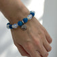 Close-up of crystal bracelet with glowing opalite and motivational apatite