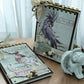 Compact A6 cockatoo spiral journal in purple and pink with 40 usable pages—handmade shabby chic notebook, customisable and perfect as a gift.
