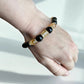 Crystal bracelet combining obsidian and citrine for grounding and confidence.