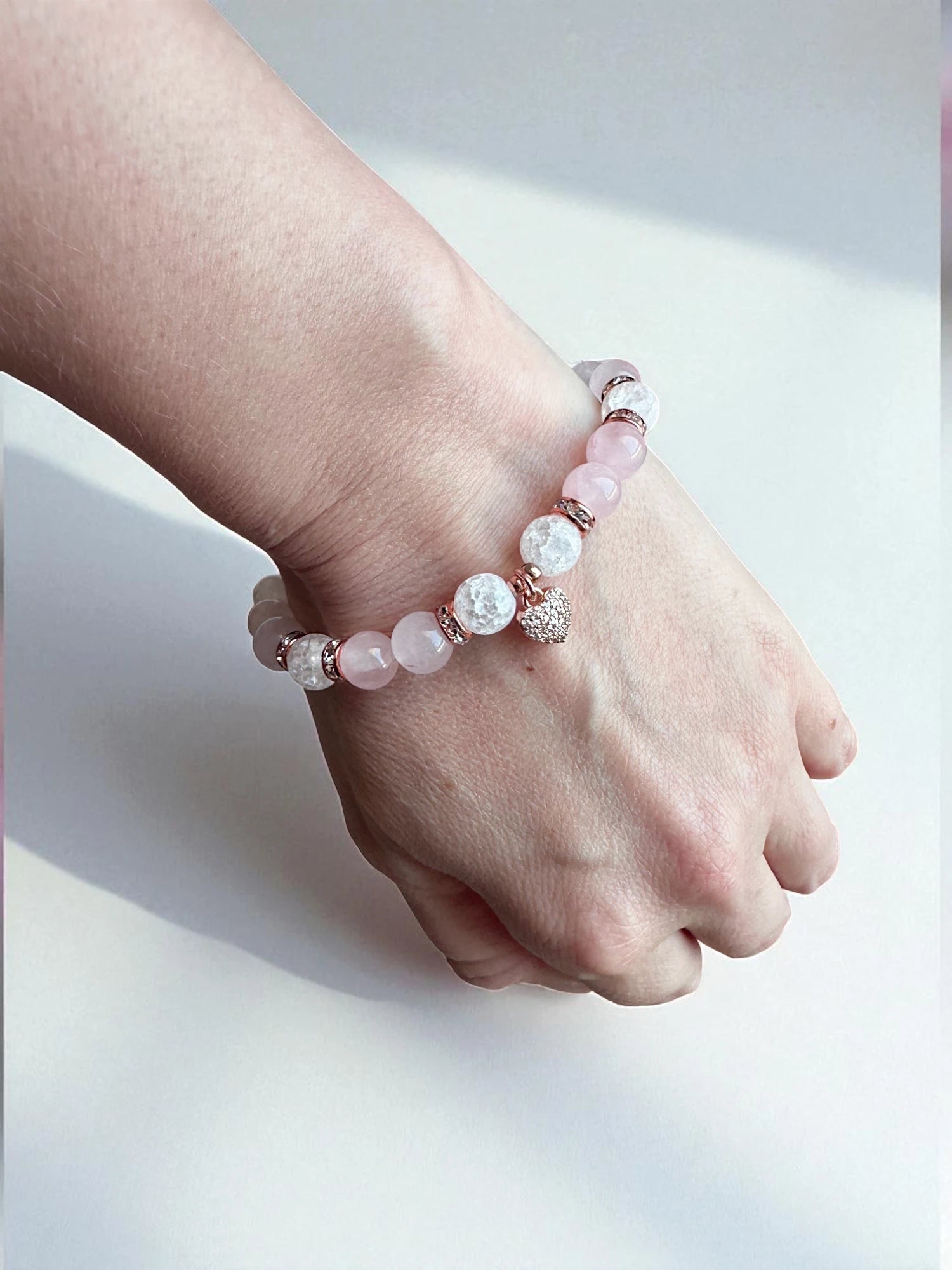 Crystal bracelet combining rose quartz and clear quartz for balance and compassion