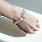 Crystal bracelet combining rose quartz and clear quartz for compassion and clarity