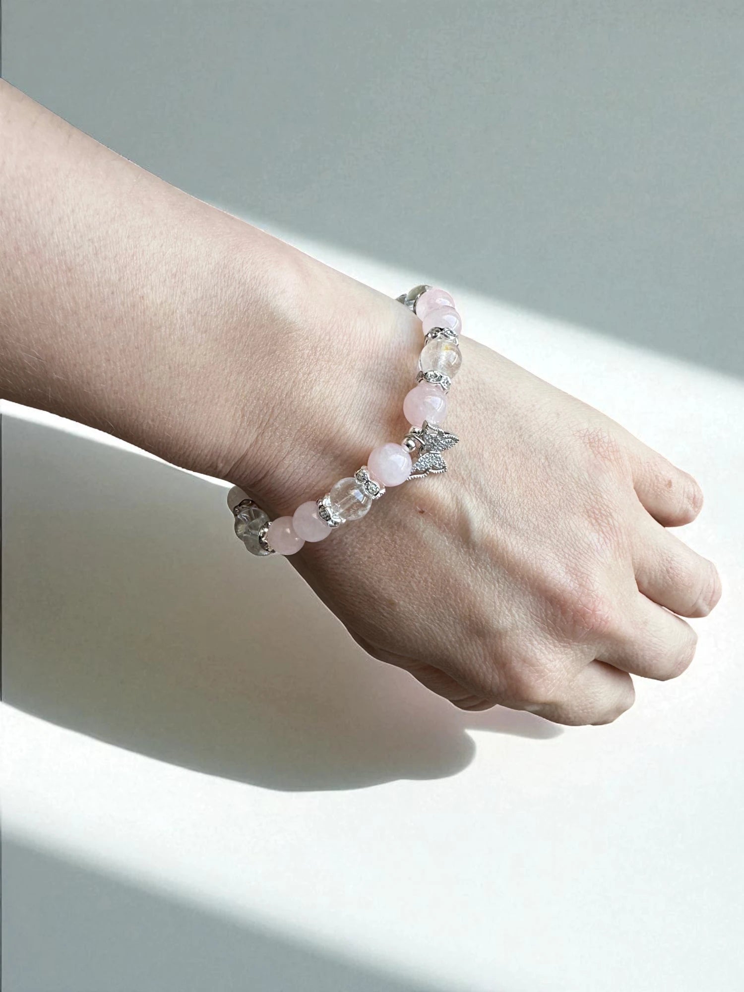Crystal bracelet combining rose quartz and clear quartz for compassion and clarity