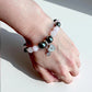 Crystal bracelet combining rose quartz and hematite for balance and grounding