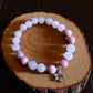 Crystal bracelet combining rose quartz and pink opal for compassion and renewal.