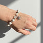 Crystal bracelet with snowflake charm and wintery healing vibes