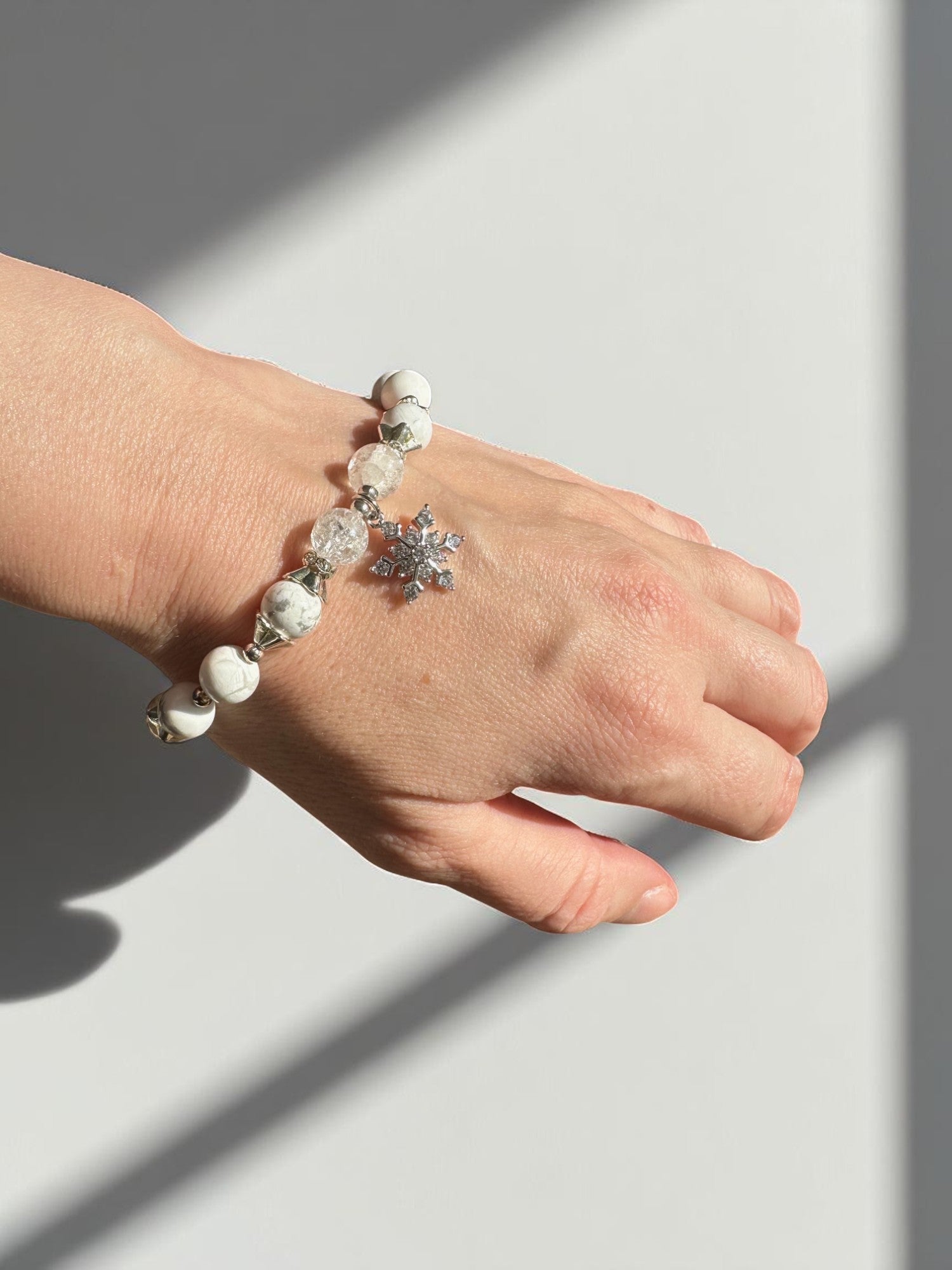 Crystal bracelet with snowflake charm and wintery healing vibes