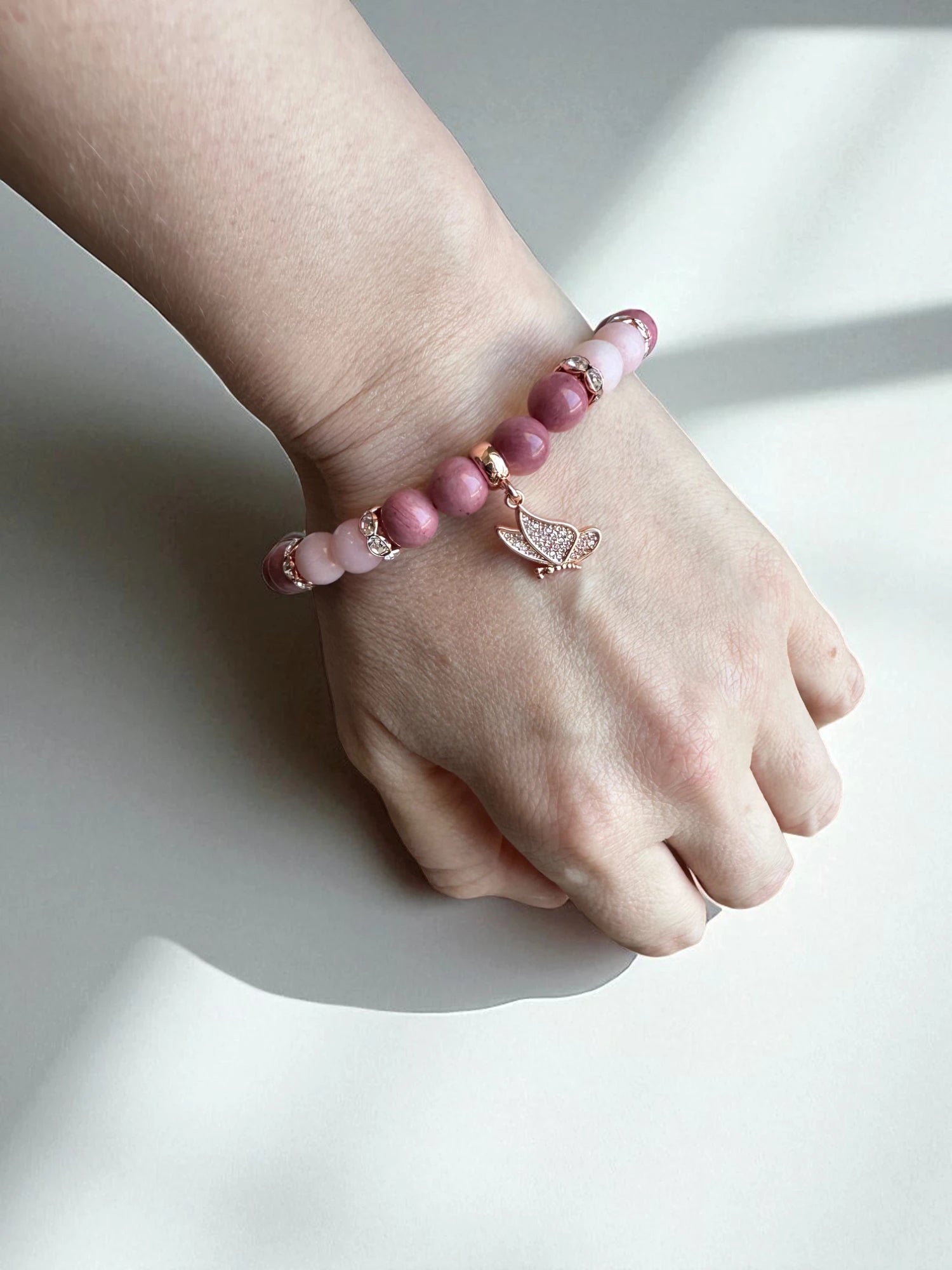 Crystal jewellery Australia featuring a rhodonite and pink opal bracelet