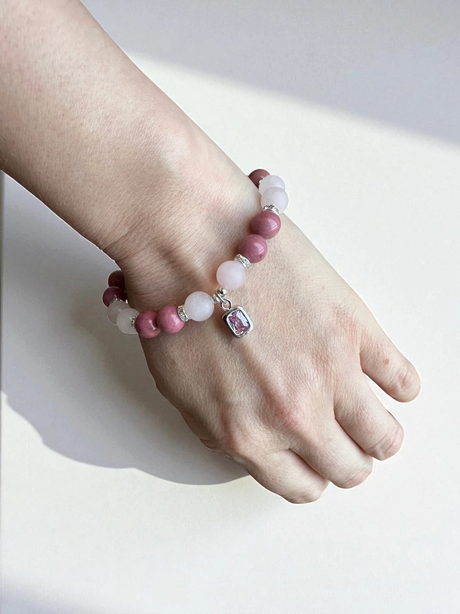 Crystal jewellery Australia featuring a rhodonite and rose quartz bracele