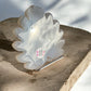 Durzy agate crystal shape in leaf on a stand