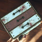 Flat lay of Christmas shabby chic photo box album with vintage papers, ribbons and lace—handmade photo organiser chest for holiday memories.