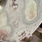 Flower formation on pink amethyst crystal heart