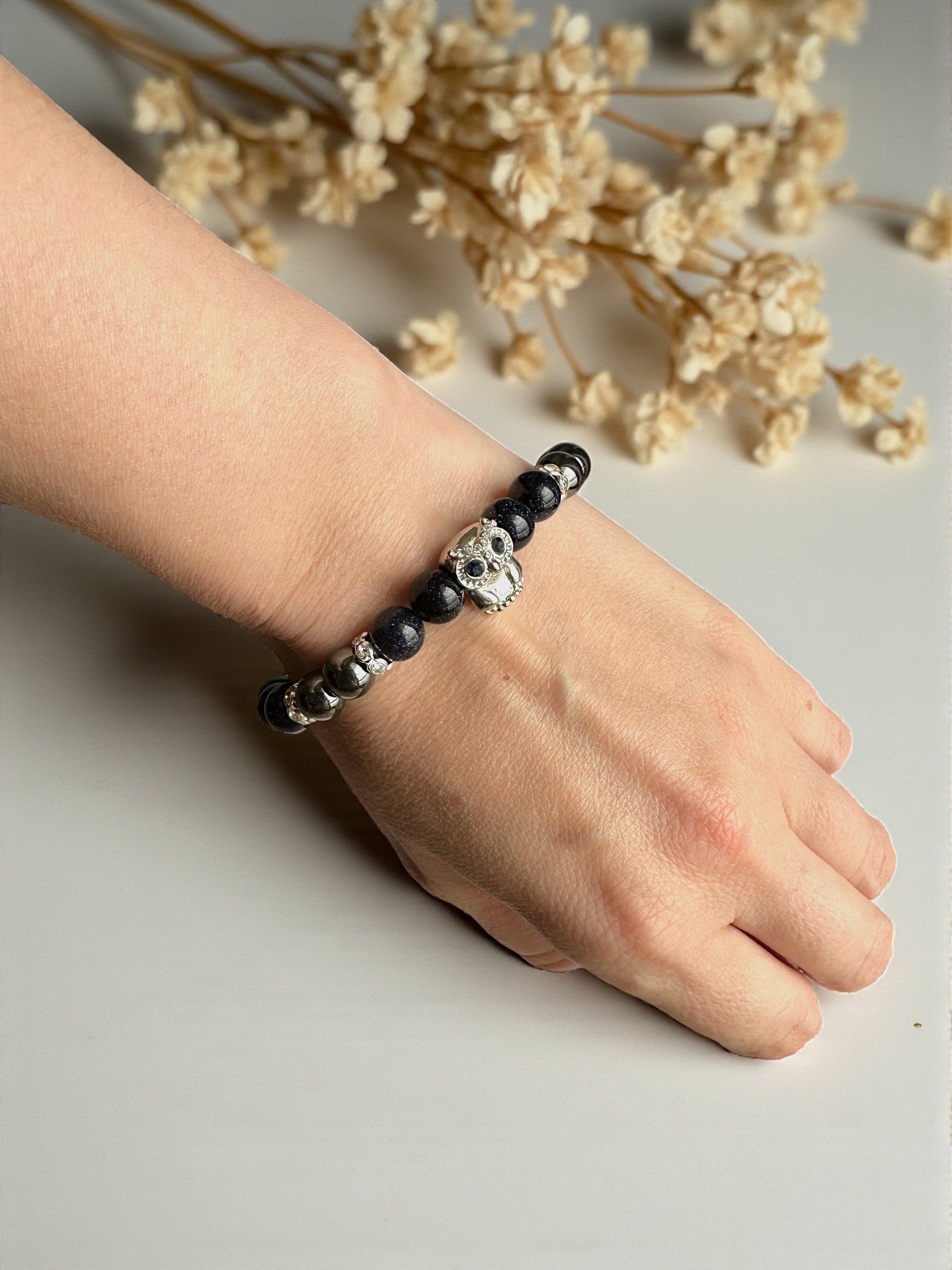 Gemstone bracelet with Blue Goldstone and Hematite promoting ambition