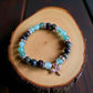 Green aventurine and dragon bloodstone gemstone bracelet for luck and strength.