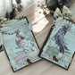 Handmade A6 cockatoo spiral notebook with 40 white pages, golden spiral top binding and removable bow—customisable shabby chic journal in purple and pink.