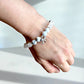 Handmade crystal bracelet with howlite and clear quartz beads.