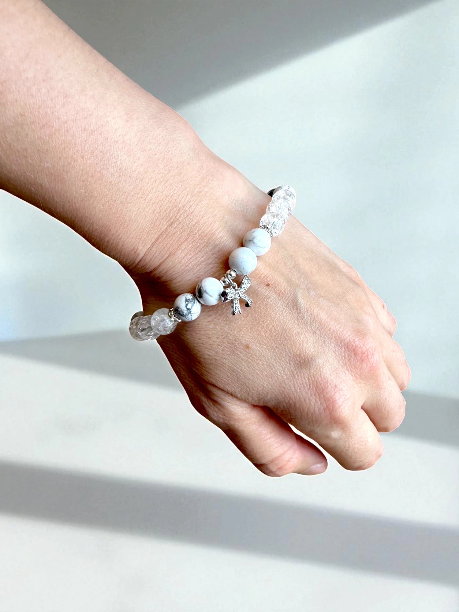 Handmade crystal bracelet with howlite and clear quartz beads.