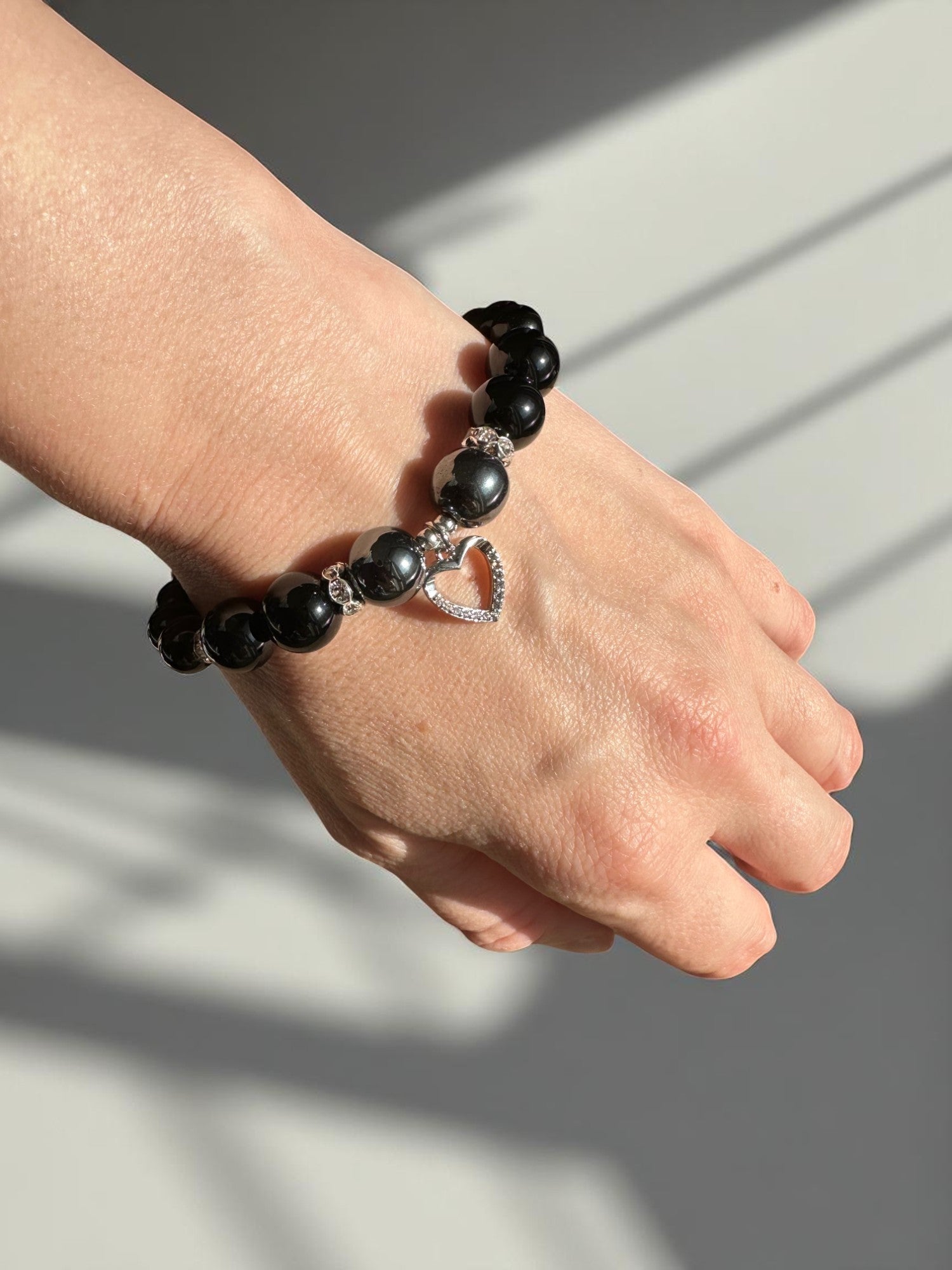 Handmade grounding and protective crystal bracelet with heart charm