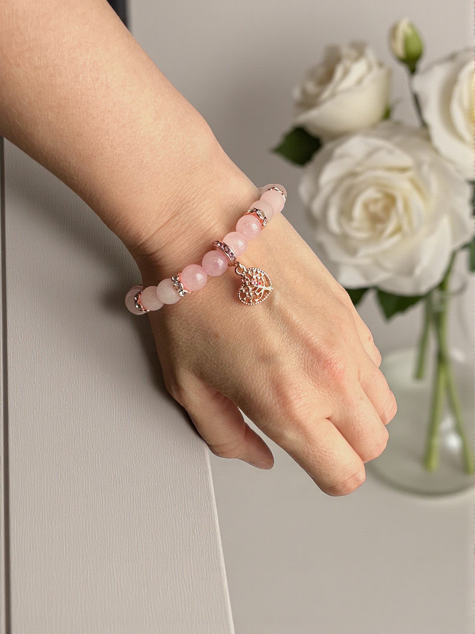 Handmade pink gemstone bracelet promoting compassion and self-love