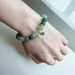 Healing bracelet combining aventurine and moss agate for stability and growth.
