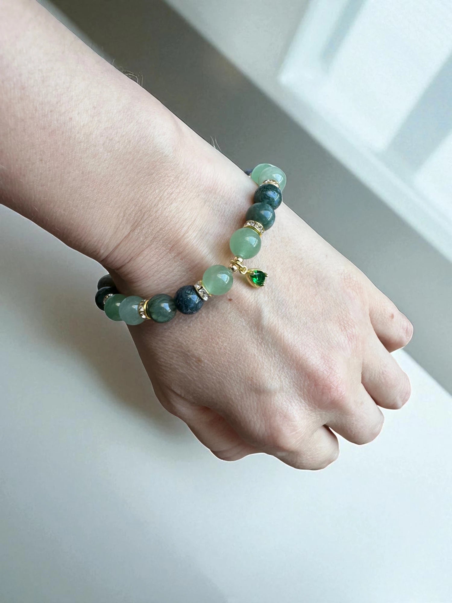 Healing bracelet combining aventurine and moss agate for stability and growth.