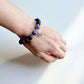 Healing bracelet combining sodalite and blue goldstone for balance and protection.