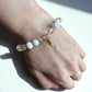 Healing bracelet with howlite and clear quartz beads for renewal and balance.