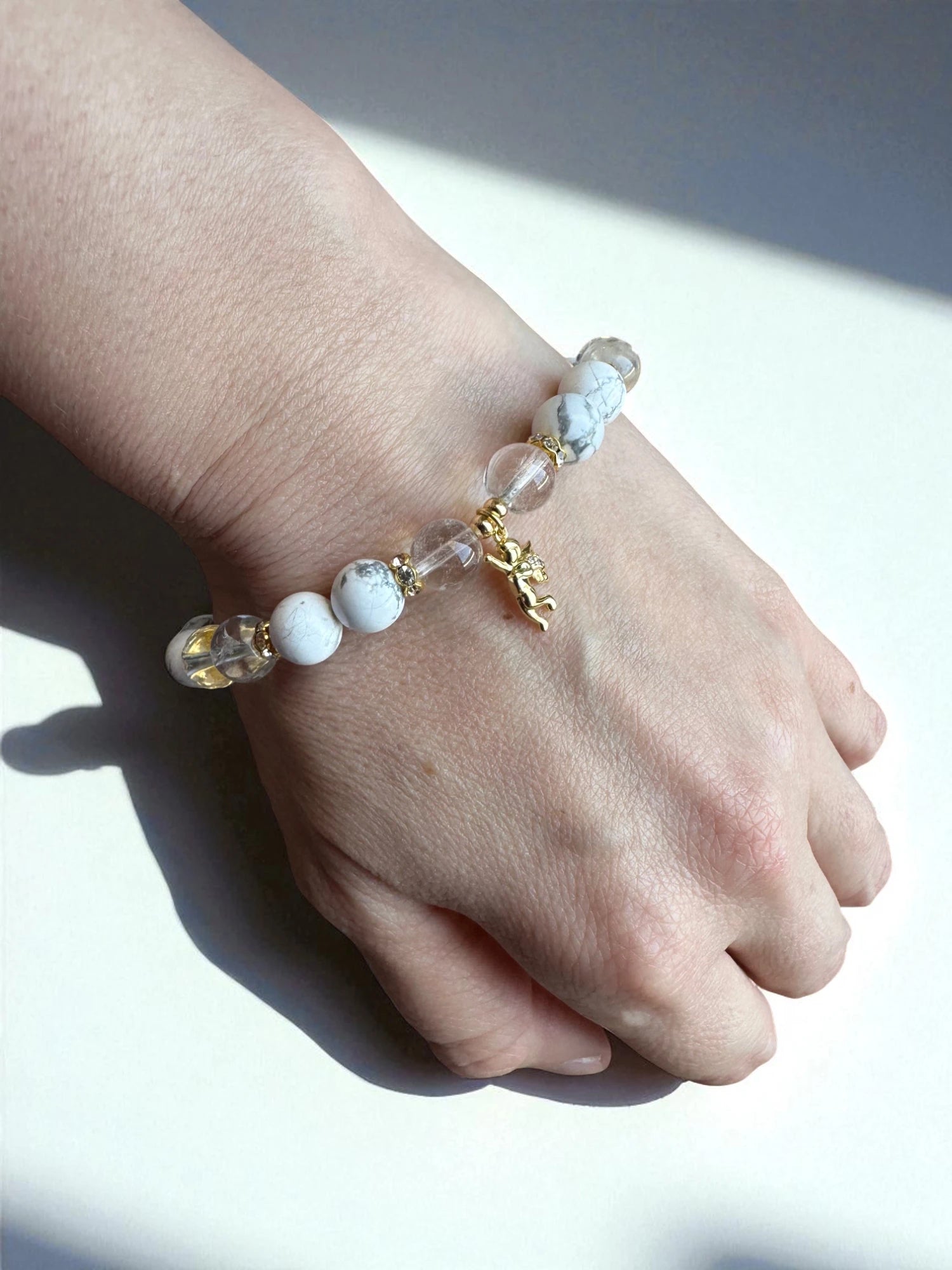 Healing bracelet with howlite and clear quartz beads for renewal and balance.