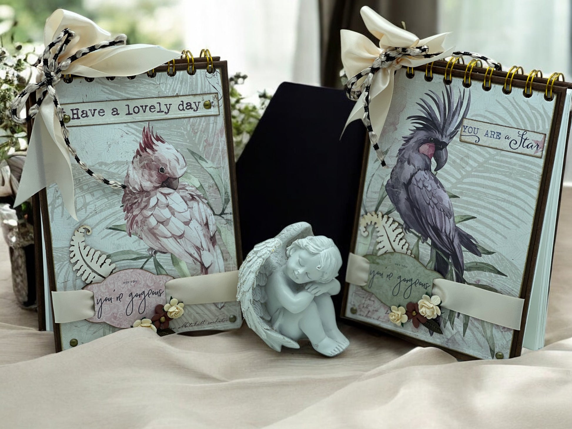 Lovely Australian cockatoo A6 notebook with hardbound spiral and decorative bow—artisan handmade stationery for writing, notes and journaling.