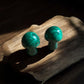Malachite mushroom crystal figurines on a slab