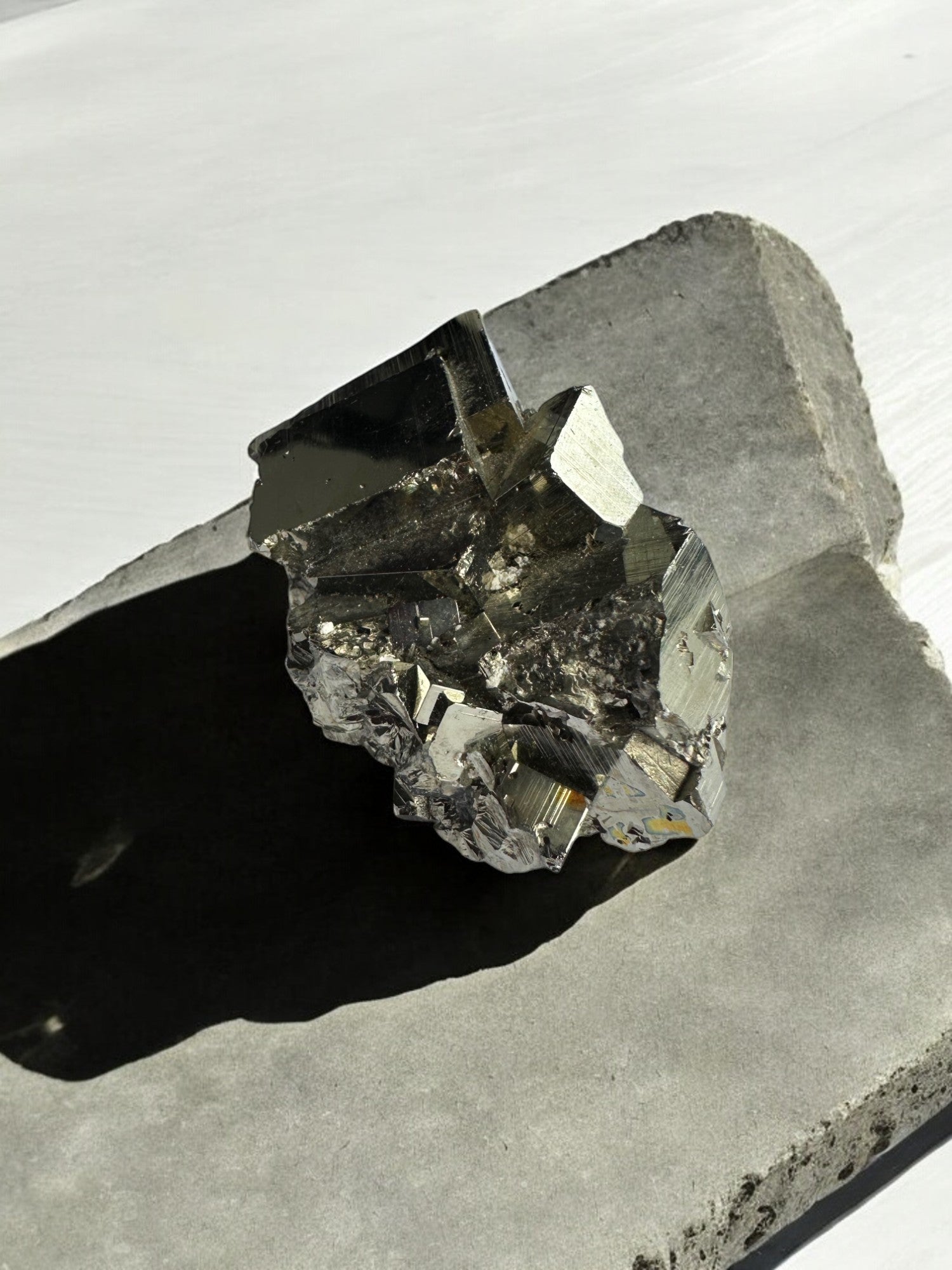 Metallic gold Pyrite cubes on natural matrix
