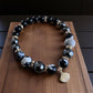 Orca agate, hematite, and black onyx bracelet with seashell charm