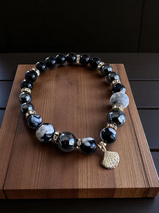 Orca agate, hematite, and black onyx bracelet with seashell charm