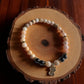 Pink Opal and Hematite bracelet with cute cat charm on a white background