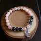 Pink aventurine and smoky quartz gemstone bracelet for balance and protection.