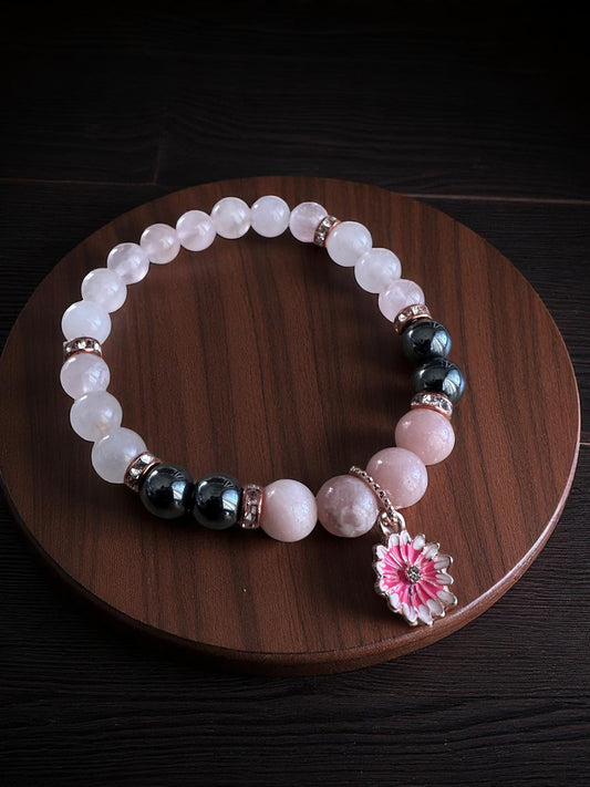 Pink opal, rose quartz, and hematite bracelet with flower charm