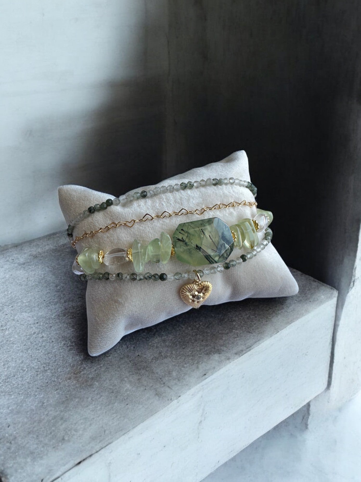 Prehnite 4-Row 18K Gold Plated Crystal Bracelet on a pillow