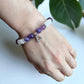 Purple and clear gemstone bracelet designed for meditation and stress relief.