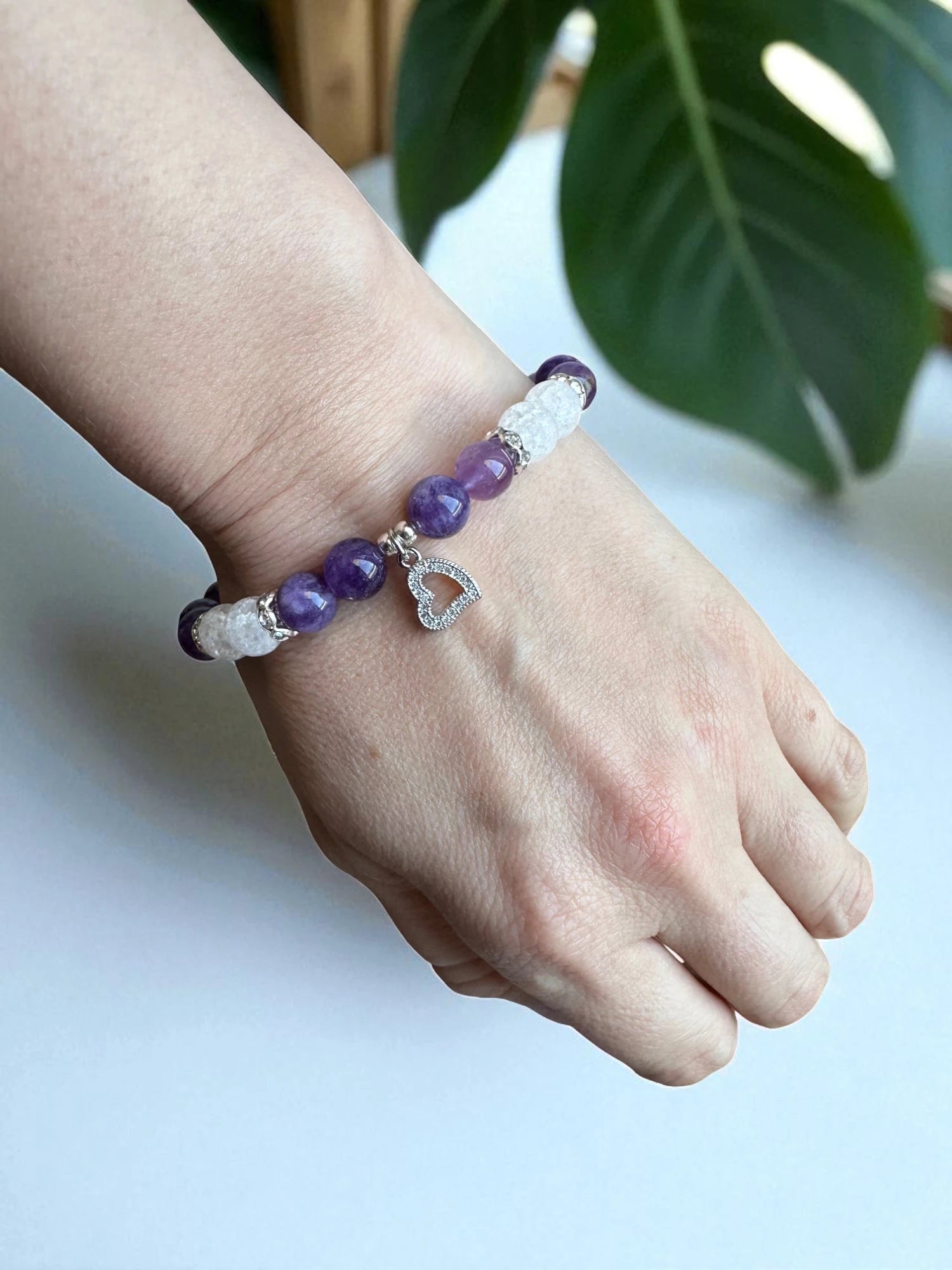 Purple and clear gemstone bracelet designed for meditation and stress relief.