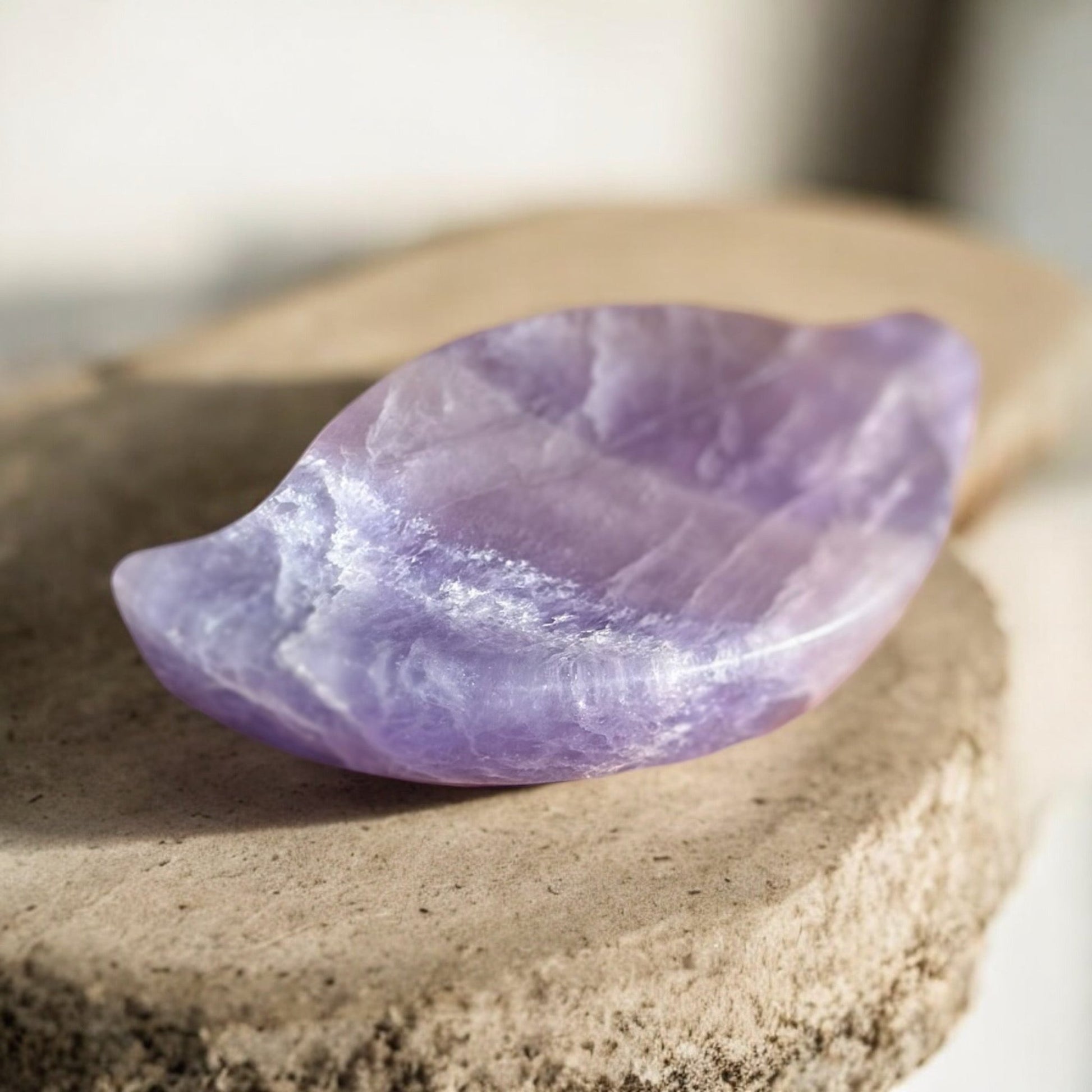 Purple fluorite crystal bowl on a slab