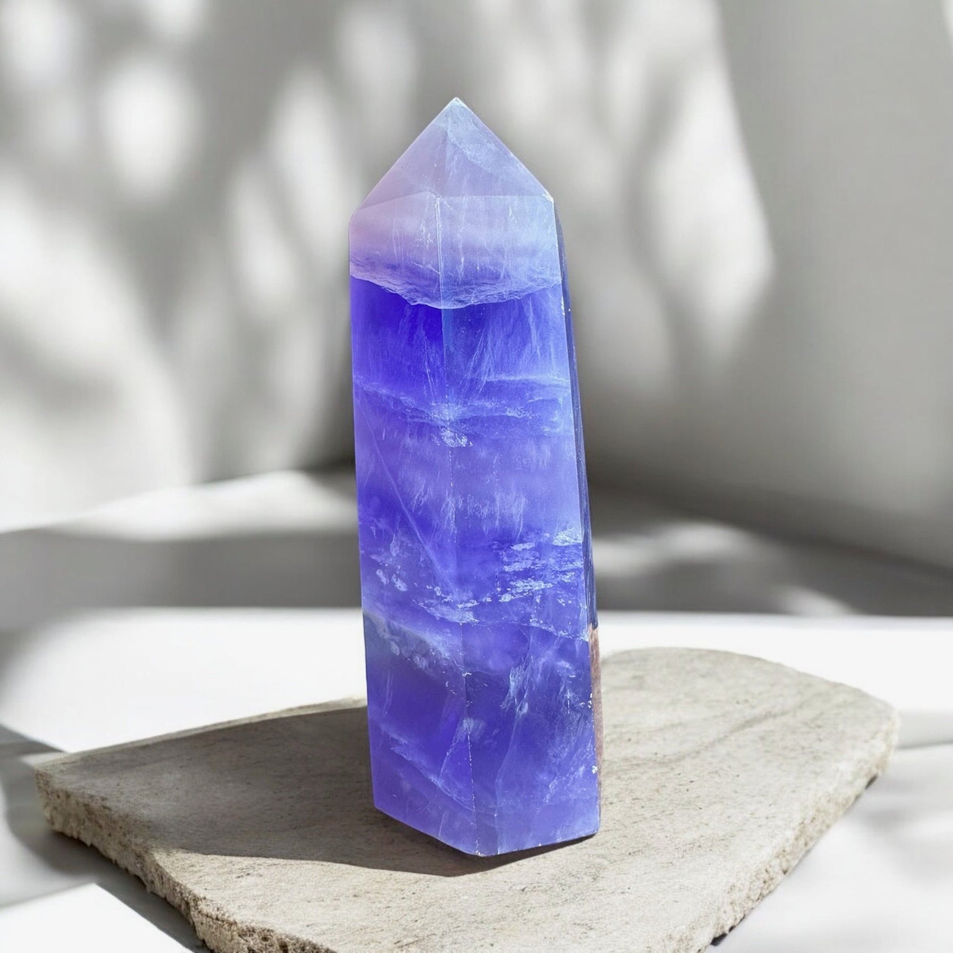 Purple fluorite crystal tower on a slab