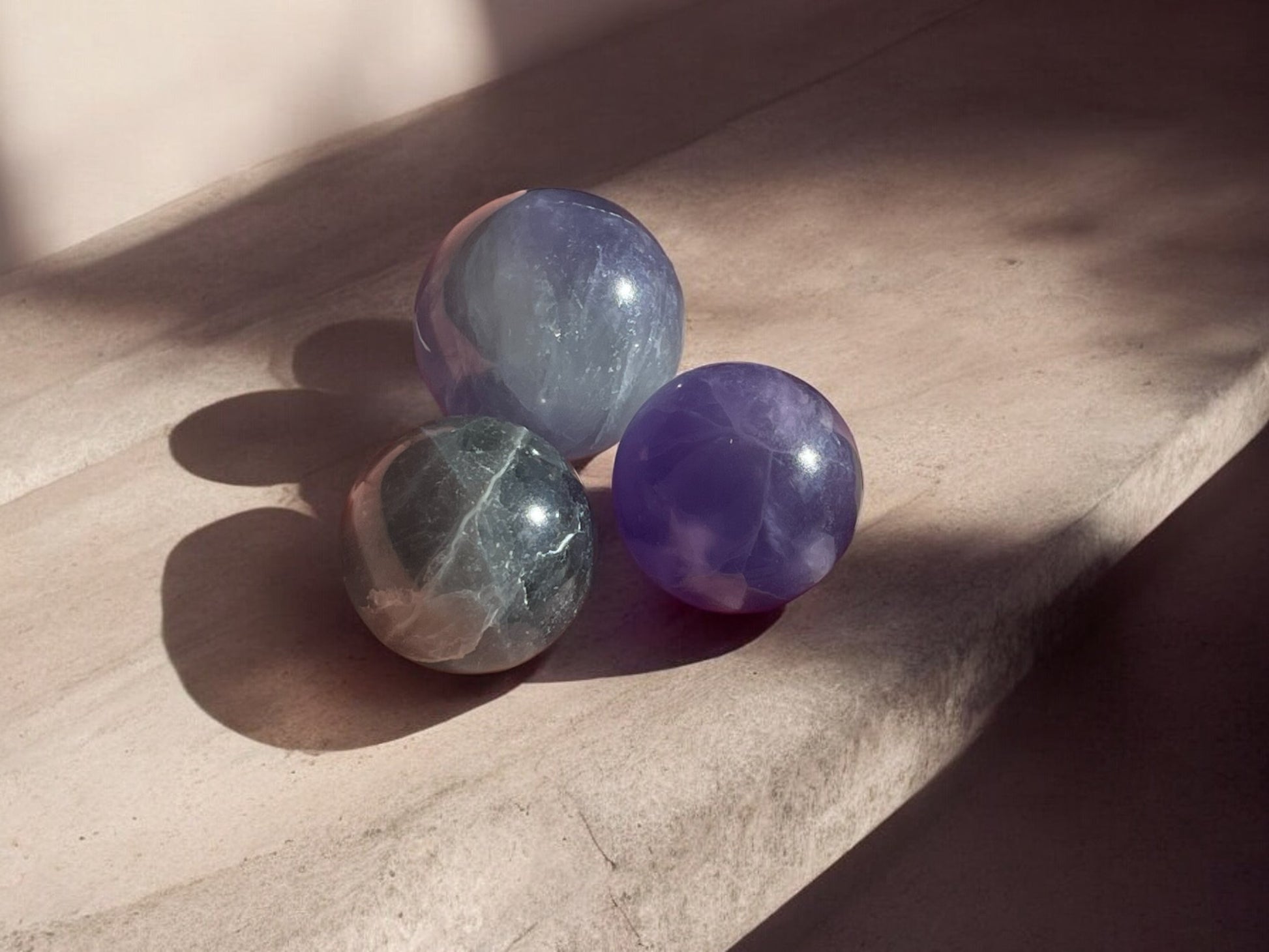 Purple fluorite mini crystal spheres on concrete