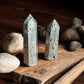 Pyrite crystal towers on wooden slab